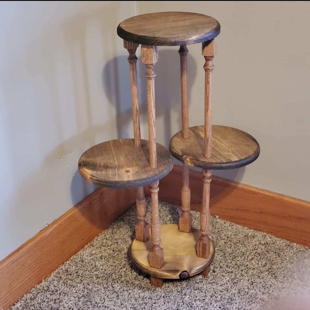 a picture of a multilevel display table, or plant holder